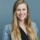 Headshot of a woman with long hair blonde and blue blazer